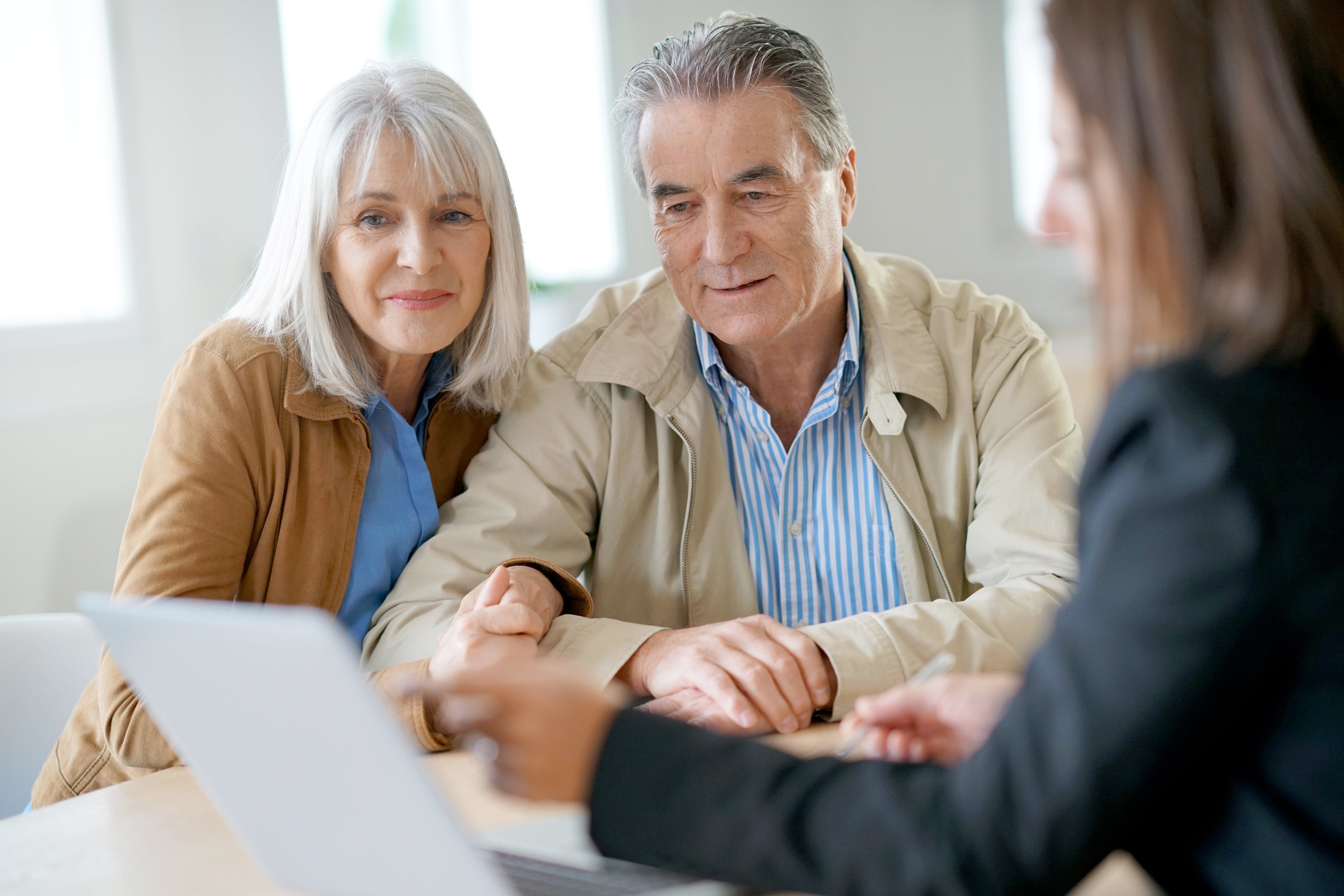 couple writing a trust with a lawyer